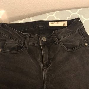 Washed black moto style black ankle length jeans